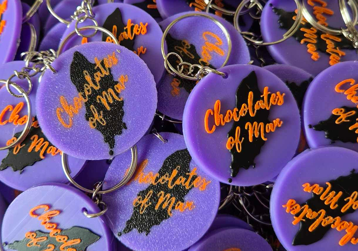 A box filled with custom business keyrings